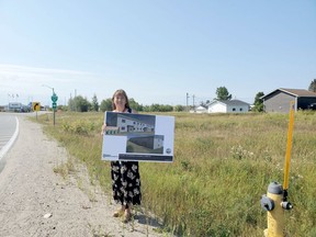 Susan Nelson, Executive Director of Ininew Friendship Centre holds up a drawing of their proposed 16-unit housing complex that they hope to build across from the water tower.