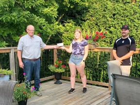 Brian Downie (left), president and CEO of West Elgin Mutual Insurance, presents a $1,000 bursary cheque to Rodney-Aldborough Fair Ambassador Tori Acres (middle), with Rodney-Aldborough Fair board president Dan Balint (right). Jill Downie photo