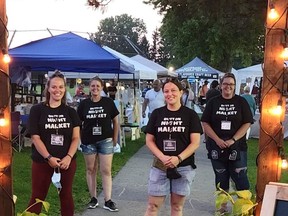 Dutton Night Market Committee -- The Dutton Night Market Committee stands at the entrance of the event that Members of the Dutton Night Market committee are Rachel Soos, Ashley Ross, Kasi Burke and Maryjo Tait.  Absent from the photo were Dave Galloway and Trish Corneil. The Aug. 7 event was highly success and attracted an estimated 3,000 people. Municipality of Dutton Dunwich photo