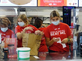 Staff at Kenora's A&W spend some time preparing orders on "Burgers to Beat MS Day" on Thursday, Aug. 19. The local fast food chain raised $37,850.81 for multiple sclerosis.