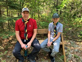 Adam Gerhard, left, and his son Matthew Gerhard, 11, who built benches on the Aspen Trail in Sioux Narrows.