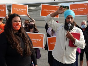 Federal NDP leader Jagmeet Singh, right, addresses a crowd of supporters alongside Kenora candidate Janine Seymour at the Kenora Airport during a campaign stop on Thursday, Aug. 26.