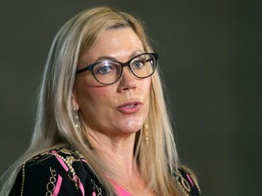 Families Minister Rochelle Squires meets with the media after the opening of the spring sitting at the Manitoba Legislature in Winnipeg on Wednesday, March 3, 2021.