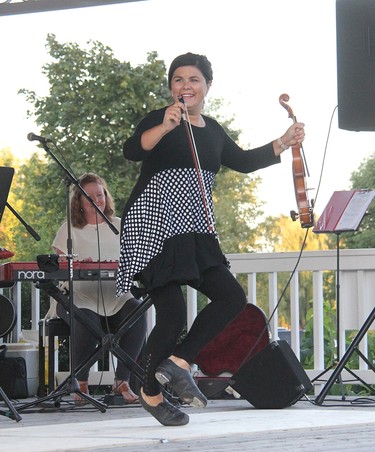 Popular local fiddler and stepdancer Krista Rosien kicks up her heels during the Mel Gardner Tribute night held at the Pembroke waterfront in the amphitheatre on Sep. 1.