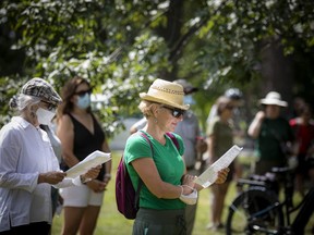 A large group gathered to sing their protest against the removal of mature trees to make way for buildings and parking for the Ottawa Hospital, Sunday, August 15, 2021, in the Experimental Farm near the Arboretum. (ASHLEY FRASER/Postmedia Network)