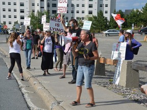 Protesters gather Tuesday outside the University of Sudbury as Prime Minister Justin Trudeau made a campaign stop. Many were opposed to the idea of a vaccine passport. Jim Moodie/Sudbury Star
