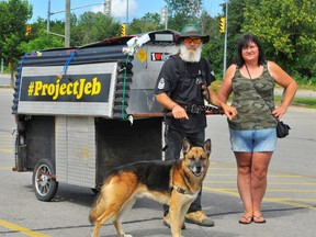Dan Perrins, of Dundas, and his dog Charger are in the midst of a 500-kilometre walking tour of southern Ontario. The pair is raising awareness about mental health issues, especially as it regards men. During a stopover on the Queensway East in Simcoe Wednesday, Perrins was joined by long-time friend Brenda Marie Caldwell of Tillsonburg. – Monte Sonnenberg