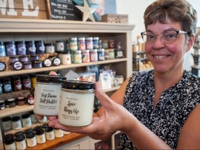 Sue Griffiths, owner of Stone Home Creatives on Queen Street, is hoping a line of candles representing all the smells of downtown St. Marys helps encourage shoppers to support local stores. (Chris Montanini, Stratford Beacon Herald)