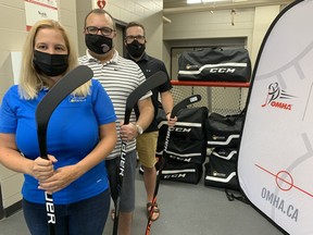 The Egg Farmers of Ontario, in partnership with the Ontario Minor Hockey Association, delivered 35 complete sets of hockey equipment to Talbot Gardens in Simcoe Thursday for distribution to young players starting out in the game. On hand for the occasion were, front to back, EFO rep Joanne Hayes of Tillsonburg, Simcoe minor hockey president Martin Jefferson, and OMHA rep Daniel Clement. – Monte Sonnenberg