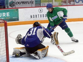 Sudbury Wolves forward Chase Stillman tries to score on goaltender Ben Rossi during a training camp scrimmage at Sudbury Community Arena in Sudbury, Ontario on Thursday, September 2, 2021.