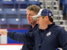 New Sudbury Wolves head coach Craig Duncanson, left, with associate coach Darryl Moxam, admitted Sunday’s win over the Soo Greyhounds probably wasn’t the prettiest game, but said he appreciated the victory. Ben Leeson/Postmedia