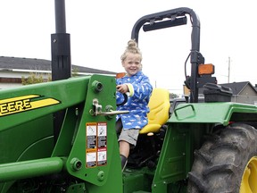 Six-year-old Radford MacInnes had the chance to sit atop a farm tractor during the Mountjoy Farmers’ Market on Saturday. That might not seem like a big deal for youngsters who live on a farm, but it isn’t often children living in the city get such an opportunity. Next week, the market will be hosting a drawing competition for children. RICHA BHOSALE/THE DAILY PRESS