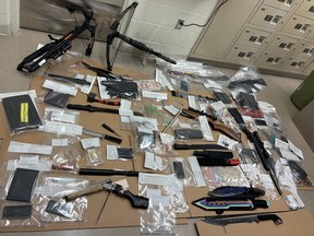 Following a lengthy investigation, RCMP seized a number of items, including; irearms, a prohibited firearm, a quantity of ammunition, knives, drugs believed to be methamphetamines and cocaine, tobacco, a quantity of Canadian currency, drug paraphernalia and electronics.