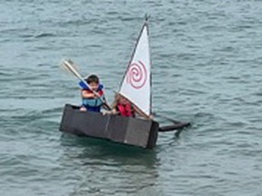 Owen McKinlay sets sail in his cardboard boat at the annual Marine Heritage Festival on Saturday, August 28. SUBMITTED