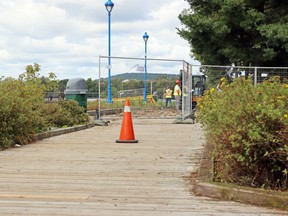 The wooden boardwalk at the waterfront marina is removed, Thursday. Michael Lee/The Nugget