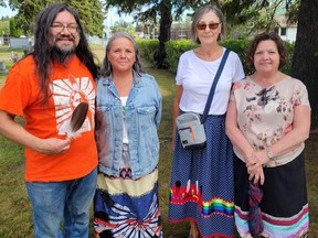 David Thompson, Carol Hermiston, Francis Buchanen and Cathy Alisch, partake in the ceremony in Thunder Bay to honour Emma Lafford's unmarked burial in a mass grave in 1910. Provided