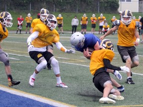 Kaiden Fisher, of the Superior Steelhawks, crashes in for a touchdown during a competitive practice against the Korah Colts at the Superior Heights football field on Tuesday night. The Steelhawks kick off the football season on Saturday afternoon when they play the St. Mary's Knights, Kick-off is at 1 p.m. at the Superior football field. GORDON ANDERSON/POSTMEDIA