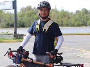 Rylee Nepinak, who is cycling from Vancouver to Halifax to raise awareness about the youth suicide crisis in Tataskweyak Cree Nation in Manitoba, made a stop in Timmins this week. DARIYA BAIGUZHIYEVA/LOCAL JOURNALISM INITIATIVE