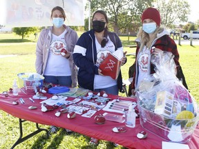 Members of Timmins Children’s Treatment Centre, from left, Samantha Mongeon, Liane Guenette and Cassandra Rivers were out educating the public and trying to end the stigma surrounding fetal alcohol spectrum disorders at Gillies Lake on Thursday. Fetal Alcohol Spectrum Disorders Day is recognized each year on Sept. 9. RICHA BHOSALE/THE DAILY PRESS