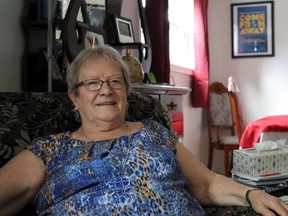 Beulah Cooper, in her home in Gander, Nfld., surrounded by family photos and Come From Away musical memorabilia. NADINE ROBINSON