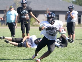 St Mary's Knights running back Christian Omollo runs the ball during practice on Thursday afternoon at the St. Mary's football field. The Knights open the 2021 football season when they face the Superior Heights Steelhawks on Saturday afternoon. Kick-off is set for 1 p.m. at the Superior Heights football field.