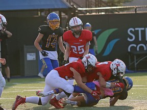 The Sal Comp Sabres didn’t give the Bev Facey Falcons much room in Friday’s 35-0 season-opening win at Emerald Hills Stadium. Photo courtesy Connie Nichol