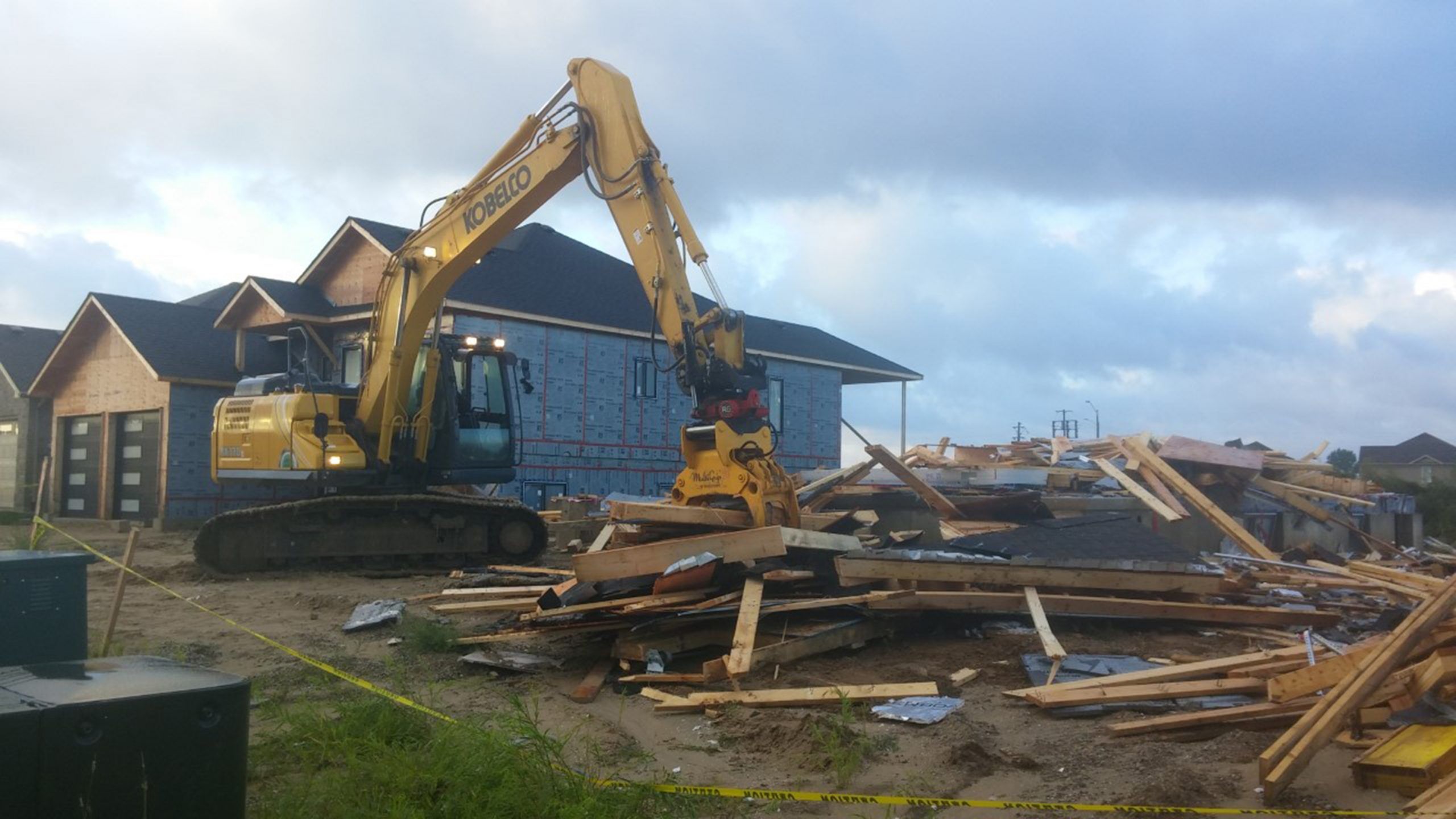 A crew clears away the debris left of two houses that were under construction on Northport Dr. in Port Elgin which were heavily damaged by the storm.