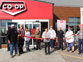 Mayerthorpe Mayor Janet Jabush, centre, cut the ribbon on the renovated Pembina West Co-op, joined by Ivan Kusal, Walter Preugschas, Susan White, Faye Branden, Joan McLenaghan, Holly Lingel, Dallas Stevens and Larry Jansen.