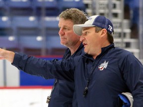 Sudbury Wolves head coach Craig Duncanson, left, listens to associate coach Darryl Moxam during a practice on the opening day of rookie orientation camp at Sudbury Community Arena in Sudbury, Ontario on Monday, August 30, 2021.