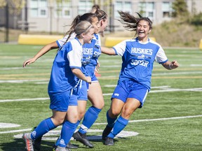 (Left to Right) Marissa Mestre, Natalie Orellana, Sabrina Lera, and Selena Arima celebrate a goal in Edmonton on Saturday, September 4, 2021. Supplied image courtesy Robert Murray/Keyano Huskies