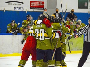 The Powassan Voodoos celebrate a goal, last Friday, versus Kirkland Lake. Mickey Naughton Photography