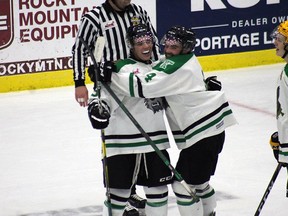 Terriers' defender Tyle Dodgson celebrates with his teammates after scoring the game winner against Virden last Tuesday in the Terriers first exhibition game of the year. (Aaron Wilgosh/Postmedia)