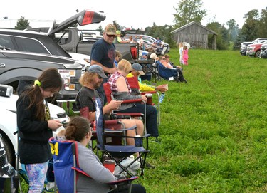 A farmers field south of the Stratford Municipal Airport was lined with parked cars Wednesday evening as spectators sat in lawn  chairs and truck beds to watch the airshow. Galen Simmons/The Beacon Herald/Postmedia Network