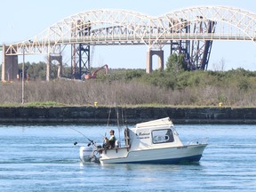 An angler on the St. Mary's River on Monday, Sept. 13, 2021 in Sault Ste. Marie, Ont. (BRIAN KELLY/THE SAULT STAR/POSTMEDIA NETWORK)