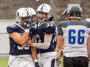 The Edmonton Wildcats had to battle the rain as well as the Winnipeg Rifles in a 20-18 loss last Sunday at Emerald Hills Stadium. Photo courtesy Jake Bradley Photography