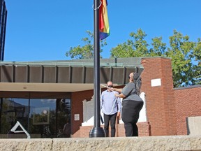 Mayor Al McDonald, left, and North Bay Pride chief executive officer Jocelyn Green mark Pride Day in North Bay, Thursday, with the raising of the Pride flag at city hall. Michael Lee/The Nugget