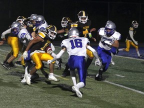 Korah Colts running back Michael Nicoletta in second-quarter action against the Superior Heights Steelhawks at the Sergeant John Faught Field House on Friday night. Nicoletta scored two touchdowns in his team's 32-17 win over the Steelhawks in city high-school football action. Nicoletta would eventually score on this play, a 9-yard touchdown run that made the score 12-0 at the time.