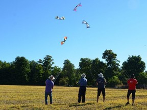 The Hot Club de Quad from Quebec performs their team kite flying routine during the 9th Line Kite Festival east of Markdale on Saturday, September 18, 2021. The team includes, from left, Dominic Guimond, Simon Roy, Serge Lepine and leader Francois Larouche. The two day festival, which attracted thousands to a rural farm on Saturday, continued on Sunday.