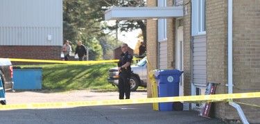 Sault Ste. Marie Police Service investigate a shooting incident that left a man dead and a police officer seriously injured near 696 Pine St., in Sault Ste. Marie, Ont., on Sunday, Sept. 19, 2021. (BRIAN KELLY/THE SAULT STAR/POSTMEDIA NETWORK)