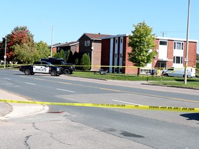 Sault Ste. Marie Police Service investigate a shooting incident that left a man dead and a police officer seriously injured near 696 Pine St., in Sault Ste. Marie, Ont., on Sunday, Sept. 19, 2021. (BRIAN KELLY/THE SAULT STAR/POSTMEDIA NETWORK)