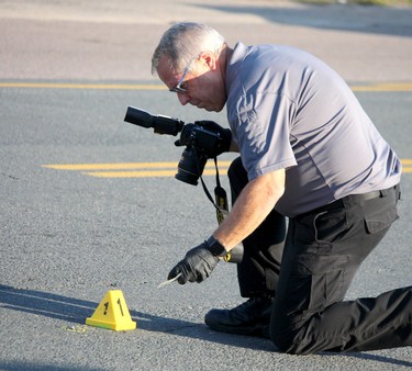Special Investigations Unit investigates a shooting incident that left a man dead and a police officer seriously injured near 696 Pine St., in Sault Ste. Marie, Ont., on Sunday, Sept. 19, 2021. (BRIAN KELLY/THE SAULT STAR/POSTMEDIA NETWORK)