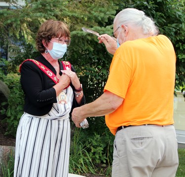 Renfrew County Warden Debbie Robinson receives a smudging from Algonquin elder Dan Ross ahead of the official reopening ceremony of the county building following an extensive renovation and consolidation of services. Tina Peplinskie