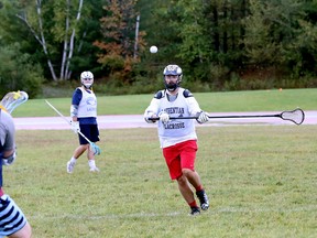 Laurentian Voyageurs lacrosse players run through a drill during practice at the Laurentian stadium in Sudbury, Ontario on Tuesday, September 21, 2021.