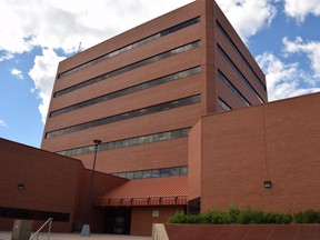 Clouds pass over Fort McMurray city hall, in Fort McMurray, Alberta on Friday, July 7, 2017. Cullen Bird/Fort McMurray Today/Postmedia Network