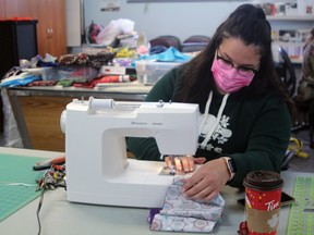 Chelsea Renaud works on a strip for one of the quilts which will be presented to residents at Suswin Village transition house when it opens next spring.
PJ Wilson/The Nugget