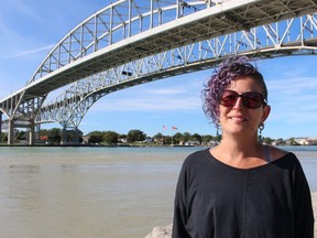 Aimée Higdon, shown here near the Bluewater Bridge border crossing in Sarnia, saw her boyfriend, who lives in Flint, Mich., for the first time in 18 months last month. Higdon spent nearly $400 to fly to Detroit, but the cost was worth it because she and her boyfriend got married. She said not being able to cross the land border has been gut-wrenching. The United States has extended restrictions on non-essential travel at its land borders until Oct. 21. (PAUL MORDEN/THE OBSERVER/POSTMEDIA NETWORK)
