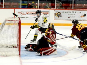 Powassan Voodoos forward Rodion Tatarenko converts on a one-timer to deposit his third of four goals on the afternoon behind Timmins Rock goalie Gavin McCarthy during the second period of Sunday afternoon’s NOJHL game at the McIntyre Arena. Timmins defender Aiden Farr made a lunging, but unsuccessful attempt to intercept the pass. The Voodoos went on to edge the Rock 5-4 in overtime. THOMAS PERRY/THE DAILY PRESS