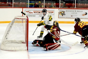 Powassan Voodoos forward Rodion Tatarenko converts on a one-timer to deposit his third of four goals on the afternoon behind Timmins Rock goalie Gavin McCarthy during the second period of Sunday afternoon’s NOJHL game at the McIntyre Arena. Timmins defender Aiden Farr made a lunging, but unsuccessful attempt to intercept the pass. The Voodoos went on to edge the Rock 5-4 in overtime. THOMAS PERRY/THE DAILY PRESS