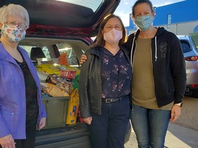 With two packed vehicles, more than 760 pounds of pet food and toys were donated to the local food bank on Thursday, Sept. 23 in honour of Alexandra Ollington. Photo courtesy Maria Popiwchak