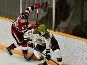 Cam Gauvreau of the North Bay Battalion shields the puck from Brad Gardiner of the Ottawa 67's in Ontario Hockey League preseason play Saturday. The visiting 67's skated to a 4-1 victory.
Sean Ryan Photo